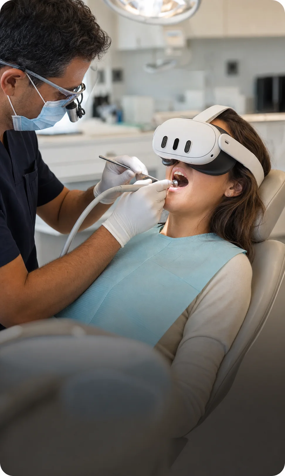 A patient wears a VR headset while receiving dental care