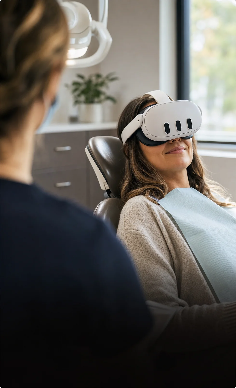 A patient reclines comfortably in a clinic chair wearing a VR headset